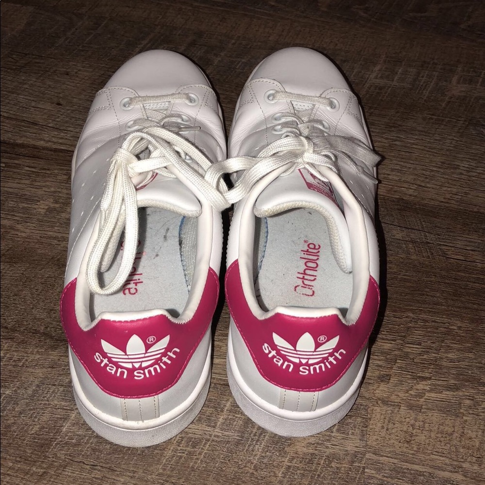 White adidas with pink back.